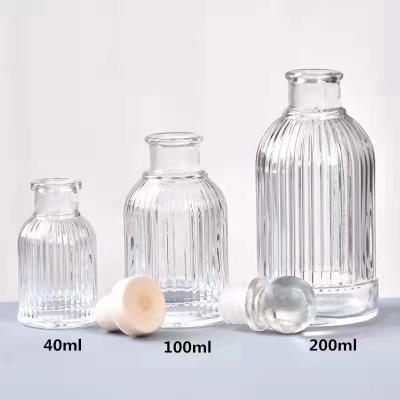 China Luxury Hot Sale Multi Purpose 40ml 100ml 200ml Crystal Glass Diffuser Bottle Essential Oil Decorative Glass Bottles Wholesale for sale