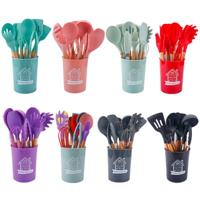 China Durable Wholesale Not Stain Storage Bucket Deformed Kitchen Accessories 11 Set Silicone Utensils for sale