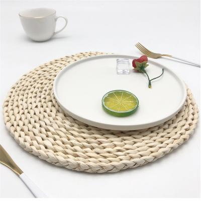 China Vietnam Woven Handmade Rattan Vintage Sustainable Style 27 Cm Fringe Area Rugs 33 Handmade Place Mats Set For Dining Table for sale