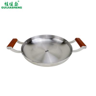 China Paella pan metal Spanish pasta paella stainless steel frying cooking pan for bbq kitchen restaurant catering with wooden handle for sale