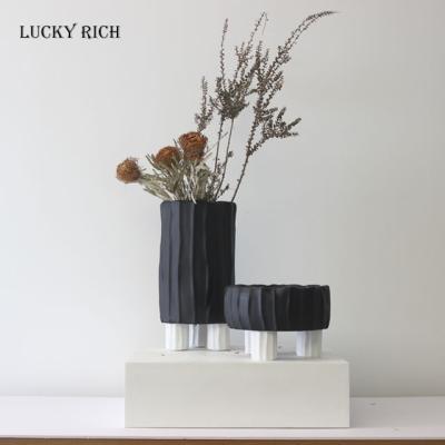 China Nordic creative ceramic frosted luxury black white vase stand vase living room decor ceramic vases small wholesale ware for sale