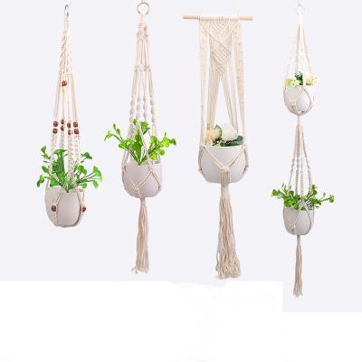 China Tropical Handmade Cotton Macrame Wall Hanging Indoor Garden Potted Plant Hanger Holder Beige Rope Set Hogar Wall Decor for sale