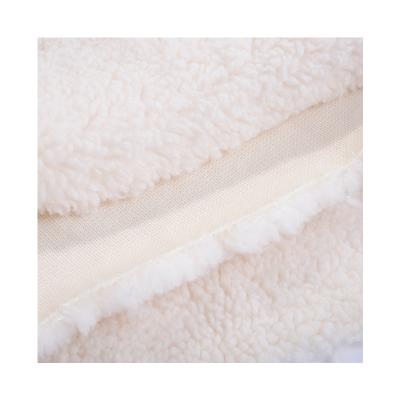 China Breathable Wheat Sherpa Velvet Polyester Lamb Fleece Imitation Curly Knitted Pellet Fur Fabric for sale