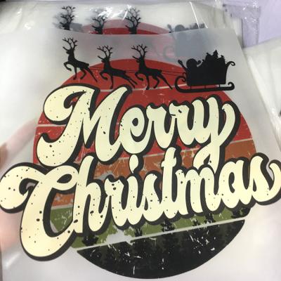 China Custom Washable And Tagless 2022 Digital Heat Transfer Iron On Logo Sticker T-shirt Plastisol Christmas Transfer Printing For Garment for sale