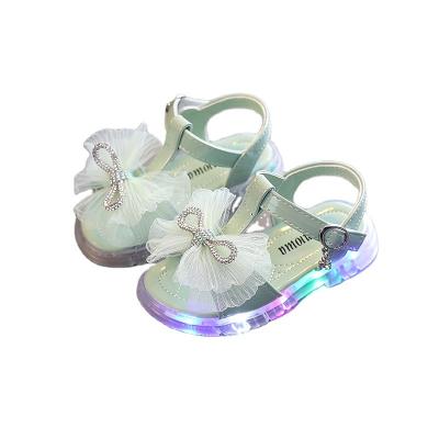 China Light Girls Shining Decorative Diamonds Sandals Children Lace Up Big Bow Fashion Kids Princess Sandals for sale