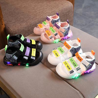 China 2021 lightweight summer outdoor led lightweight sandal kids non slip leather boys and girls beach shoes for sale