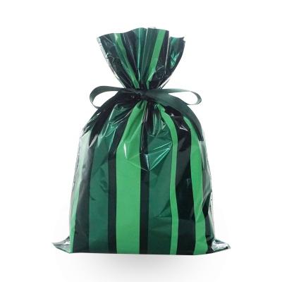 China Green Color Disposable ISO BSCi Factory Bags Christmas Gift Package Customized Design Drawstring Plastic Bag for sale