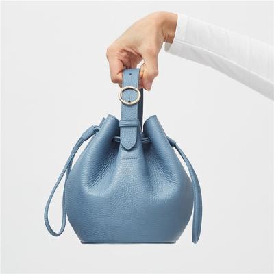 China Custom vegan ladies mini drawstring OEM ODM fashion logo women bucket bag fashion ladies leather rolling clutch bags for sale