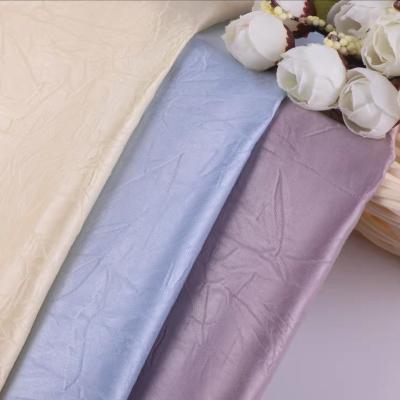 China Polyester Viable Shiny Satin Silk Fabric Bright Shiny 100% Single Yarn Dyed Wrinkle Fabrics For Dresses for sale