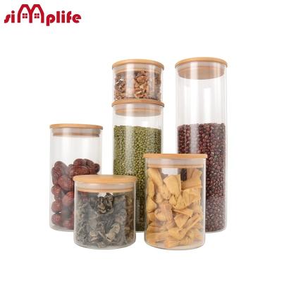 China Best heat resistant turned high borosilicate glass jar with bamboo lid. round glass jars. for sale