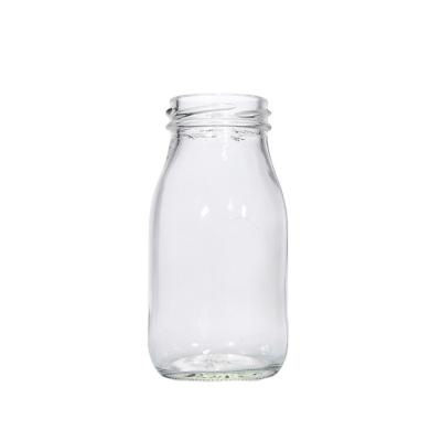 China factory wholesale order-friendly glass milk bottle with plastic lid for sale