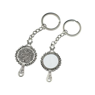 China Eco-friendly Custom Exquisite Carving Elegant Magic Mirror Key Chain Pendant Keyring for sale