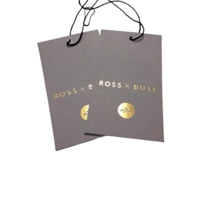 China Sustainable Luxury Retail Clothing Shoes Hand Embossed Paper Hang Tag for sale