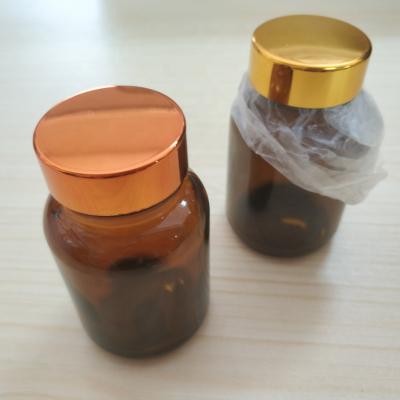 China Sustainable food grade 60ml or 70ml brown glass perfume bottle glass vial bottle for special liquid capsule powder packaging for sale