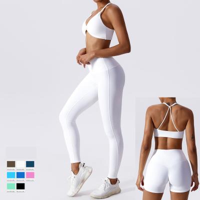 China Breathable Oem Womens Yoga Gym Athletic Patchwork Leggings Biker Shorts And Front Twist Sports Fitness Bra Top Set Yoga Wear Woman 2023 for sale