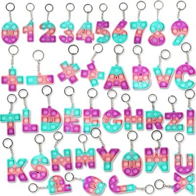 China Sensory Toy Silicone Mini Alphabet Number Fidget Toy Stirring Person Letters Push Bubble Math Symbols Key Chain for sale