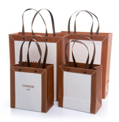 China Recyclable Chinese En Logo Kraft Paper Bags With Custom Rope Handle Wholesalers Bag Paper for sale