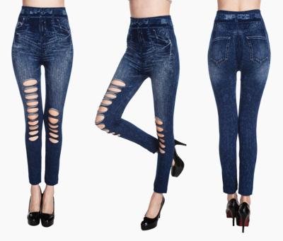 China Antibacterial Women's Seamless Cavity Slimming Jeans Legging High Elastic Denim Lattice Jeggings Pants for sale