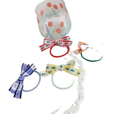 China Hair Scrunchies Wholesale Fashionable Designer Bow Elastic Hair Bands Private Label Rope Hair Tie for sale