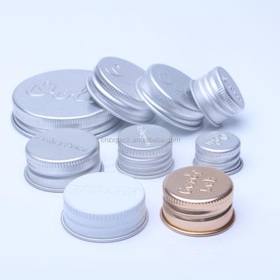 China Non Spill Logo Embossed Aluminum Screw Caps Metal Lids For Bottles And Jars for sale