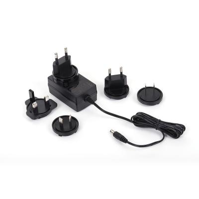 China DCSP48C UK Interchangeable Plug Power Adapter 14v 1.07a Power Supply for sale