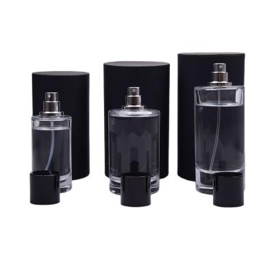 China Custom Logo Luxury Empty Spray Pump Wholesale 50ml Cosmetic Glass Cylinder Perfume Bottle for sale