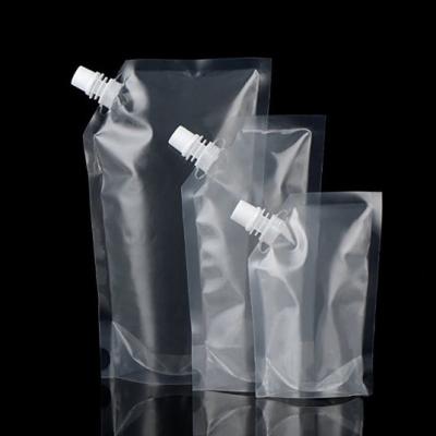 China Available Barrier Stock Customized Transparent Plastic Spout Holder Pouch With Spout Water Juice Drinking Bag for sale