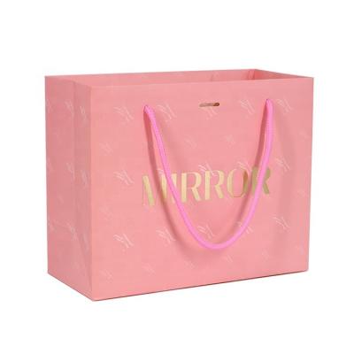 China Recyclable Biodegradable Luxury Pink Paper Gift Bag With Gold Logo Custom for sale