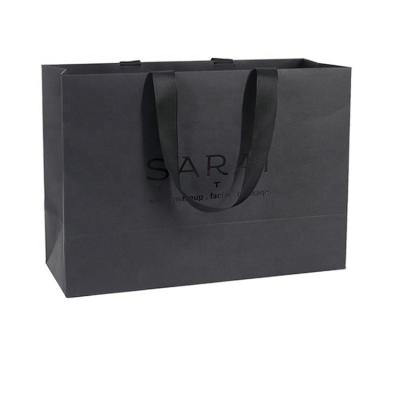 China Recyclable Wholesale Custom Printed Luxury Black Paper Shopping Bag With Handle for sale