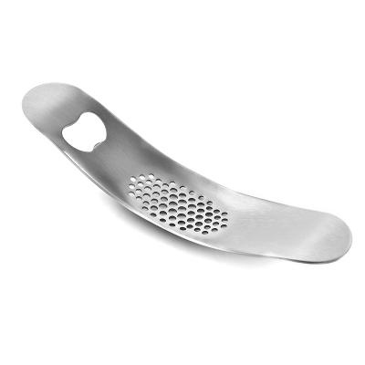 China Sustainable Steel Garlic Crusher With Bottle Opener for sale