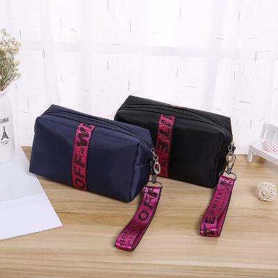 China Mini Cosmetic Bag Waterproof Makeup Waterproof Custom Nylon Pouch Letter Travel Wash Bag Portable Toiletries For Women for sale