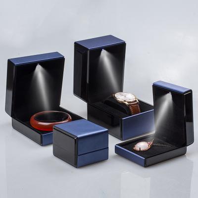 China Ornament Packaging Box Custom logo ring necklace bracelet bracelet packing box brushed leather LED light jewelry box for sale