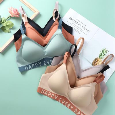 China Custom Letter Logo Latex Fashion Traceless Jelly Bralette Breathable Wireless Splicing Comfortable Women's Shockproof Seamless Bra With Pad for sale