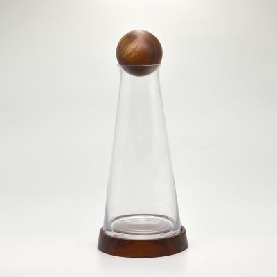 China Viable Clear Glass Water Milk Bottle Juice Bottles Cold Brew Coffee Beverage Wine Bottle with Wood Base for sale