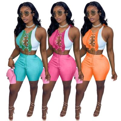 China Breathable Contrast Bandage Hollow Out Sexy Two Piece Short Set Women Clothing for sale