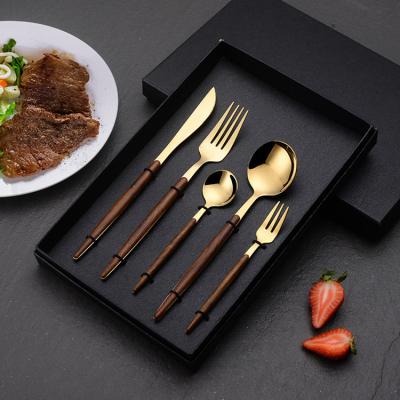 China Latest Designs Sustainable 5 Piece Home Hotel Gold Forks Bulk Gold Stainless Steel Flatware Set With Wood Handle for sale