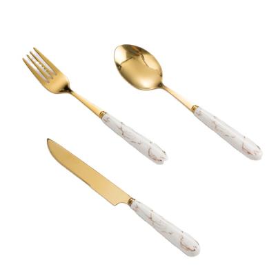 China Amazon Sustainable Hot Sale Wedding Ceramic Gold Flatware Handle Stainless Steel Flatware Set for sale