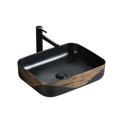 China Wash Basin Easy Clean Casual Hand Decorative Ceramic Black And Gold Plated Table Top Bathroom Sink for sale