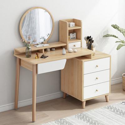 China Multifunctional solid wood dressing table personal care beauty leg Nordic modern minimalist small bedroom apartment with stool dressing table for sale