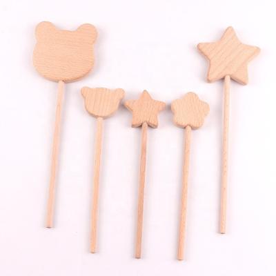 China Environmentally Friendly Wooden Crafts Materials DIY Soothing Children's Teether Stick Toy Star Flower Bear Wooden Molar Teether for sale