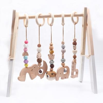 China 5pcs Musical Wooden Baby Play Gym Toys Hanging Diy Activity Baby Wooden Play Gym Infant Indoor Pendant Teething for sale