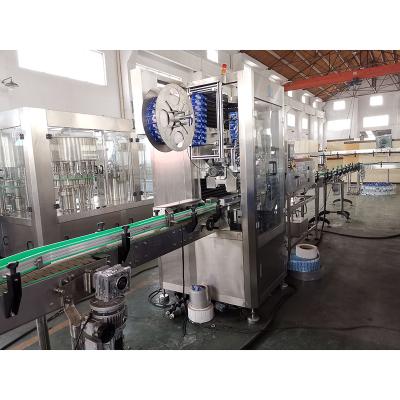 China Automatic Double Head Beverage Shrink Sleeve Bottle Labeling Machine for sale