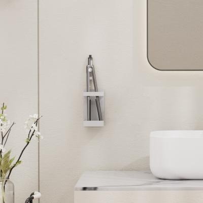 China Household atracción magnética de la pared montado estantería de baño para cabello rizado soporte de bastón en venta