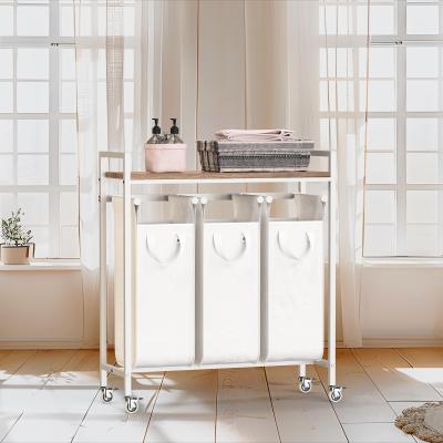 China Utility KD Structure 3 Division Big Capacity Iron Metal Wire Laundry Basket With Countertop And Wheels Laundry Hamper for sale