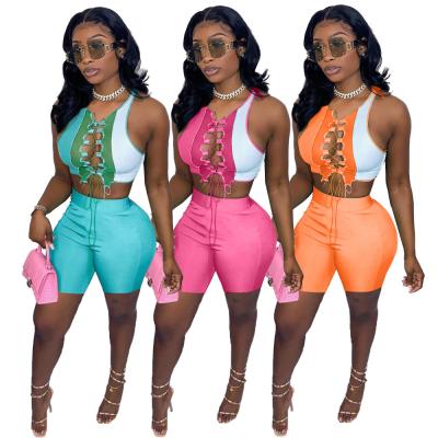 China 2021 Summer GX8361 QUICK DRY Bandage Hollow Out Solid Color Women Short Set 2 Piece Set Women's Two Piece Suit for sale