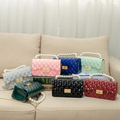 China New beautiful mini quilted messenger bag pearl handbag by fashion lady pvc jelly sling little girl handbag for sale