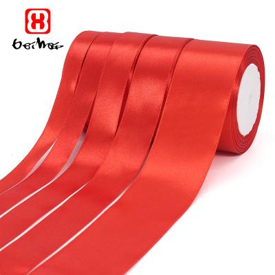 China Wholesale High Tenacity Gift Ribbon 100% Polyester Red Satin Ribbon With Logo Single Sided Bags Packaging Clothing Available For for sale