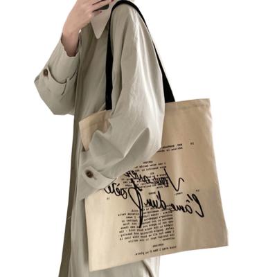 China Stylish Canvas Handled Tote Bag With Silk Screen Printing Cotton Canvas Bag Zipper Top Closure Daily Shopping Basics for sale