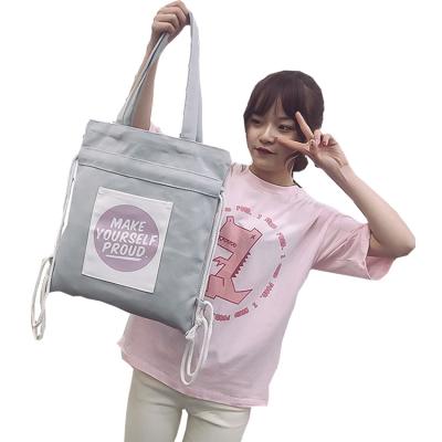 China Canvas Handled Women's Shoulder Bag INS Day Bag Students Backpack Large Capacity Canvas Drawstring Shopping Bag for sale