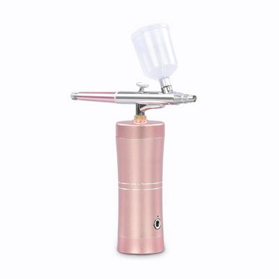 China Facial Spray Moisturizing Pink Handheld Vacuum Spray Beauty Equipment Beauty Personal Care Machine for sale